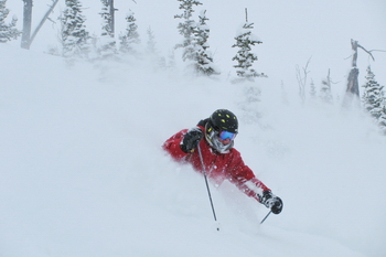 Garth, fellow ski instructor at Castle Mountain, getting lots of powder.