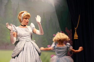 Alida shows Cinderella how she twirls.