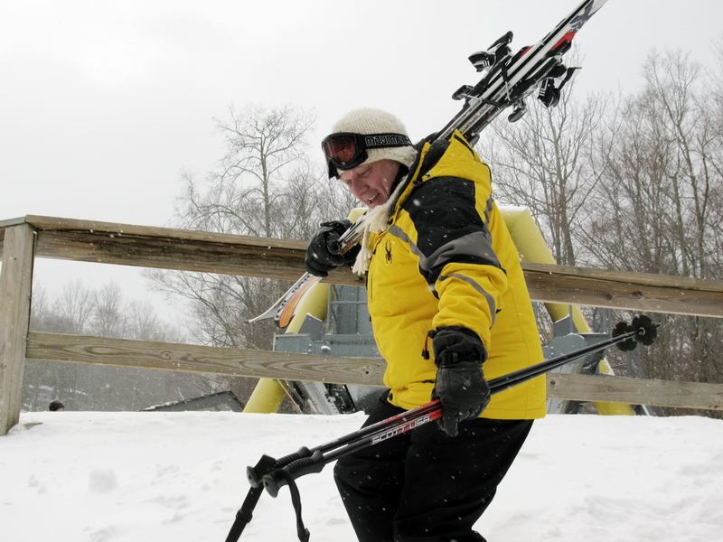 Robin bouncing down the hill with his skis after discoving he can still ski sans motor cycle injuries.