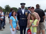 Donna, Grant and Shelby with Air Force member, from the Air Force Drill Team.